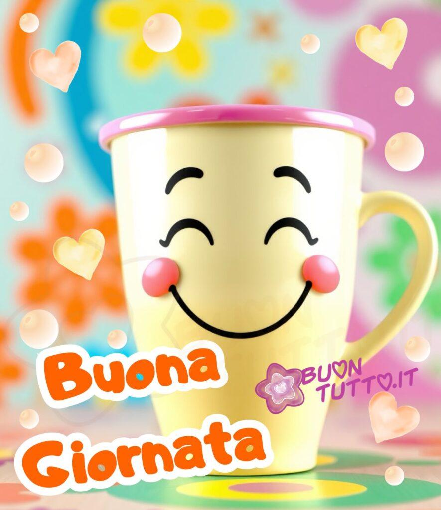 Disegno di una tazza grande di colore giallo con bordo rosa e manico giallo, con un grande sorriso che le attraversa il viso che sembra proprio un raggio di sole. Le guance rosee e gli occhi socchiusi le danno un'aria di pura felicità. Tutto intorno a lei, cuori e bolle fluttuano in un vortice di colori nello sfondo e sulla base si intravedano dei ricami geometrici colorati di fiori e cerchi. Nella parte bassa a sinistra dell'immagine c'è scritto in un carattere corsivo bombato di colore arancione e contorno bianco in grassetto Buona Giornata. È un'immagine che trasmette gioia, spensieratezza, allegria, serenità, amicizia, accoglienza e buonumore. Una raccolta di nuove bellissime immagini di Buongiorno da scaricare gratis e condividere con amici, cari, familiari, parenti gruppi tramite WhatsApp, Facebook, X Twitter, Pinterest, Telegram, LinkedIn, Instagram e le tue piattaforme social preferite. Autore BuonTutto.it
