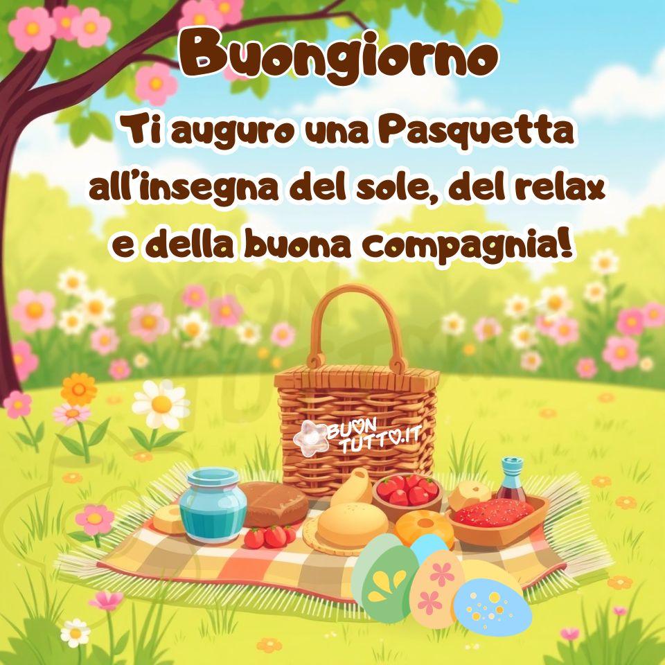 buona-pasquetta-immagini-auguri-picnic-frasi-positive-relax-buona-compagnia-prato-condividere-gratis-buontutto Disegno di un picnic di Pasquetta immerso nella natura. La scena rappresenta una Pasquetta in piena fioritura primaverile, un piccolo angolo di serenità che sembra respirare luce. In primo piano, su un prato verde illuminato dal sole e punteggiato di fiori, è stesa una coperta a quadri nei toni chiari che occupa il centro dell’immagine. Sopra la coperta si trova un cestino da picnic in vimini, aperto, con il coperchio inclinato verso l’esterno, come un invito spontaneo alla convivialità. Il contenuto del picnic è disposto in modo ordinato e invitante: pane croccante, formaggi morbidi, frutta fresca e colorata come mele e uva, insieme ad alcuni vasetti di vetro che ricordano marmellate e conserve fatte in casa, richiamando la semplicità autentica delle gite fuori porta. Accanto alle pietanze sono presenti uova di Pasqua decorate, lucide e variopinte, che aggiungono un tocco festoso e rievocano la tradizione italiana di vivere la Pasquetta all’aria aperta, tra natura, sorrisi e buona compagnia. La luce del sole è calda e avvolgente, creando un’atmosfera rilassante e armoniosa. Sul fondo dell’immagine si vedono alberi con foglie verdi e fiori primaverili, mentre un cielo limpido con nuvole bianche e soffici contribuisce a un senso di luminosità e accoglienza, quasi come un abbraccio della nuova stagione. Nella parte alta dell’immagine compare la scritta “Buongiorno” in un carattere corsivo bombato, di colore marrone caffè con contorno bianco in grassetto. Subito sotto, nello stesso stile ma con dimensione più piccola, si legge: “Ti auguro una Pasquetta all’insegna del sole, del relax e della buona compagnia”. Il testo amplifica il senso di gioia e leggerezza, trasformando la scena in un augurio caldo, gentile e profondamente primaverile. L’immagine trasmette calma, calore, convivialità e gioia stagionale. Fa parte di una raccolta di nuove e splendide rappresentazioni dedicate agli auguri di Buona Pasquetta, create per essere scaricate gratuitamente e condivise con amici, persone care, familiari, parenti e gruppi su WhatsApp, Facebook, X (Twitter), Pinterest, Telegram, LinkedIn, Instagram e tutte le principali piattaforme social. Autore BuonTutto.it