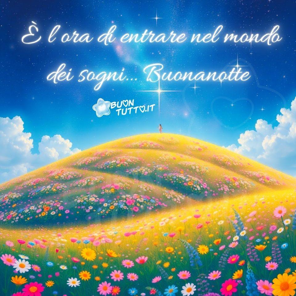 Disegno di un paesaggio notturno dal carattere fiabesco, reso con dettagli nitidi e riconoscibili. In primo piano si estendono morbide colline color giallo‑oro, modellate come dune illuminate da una luce calda e soffusa che ricorda il bagliore del tramonto e la luminosità di una luna piena. La superficie delle colline è ricoperta da piccoli fiori dai colori vivaci (rosa, blu e arancio) che punteggiano il terreno come minuscole scintille naturali. Ogni fiore sembra riflettere la luce del cielo, creando un effetto luminoso delicato e armonioso. Al centro della scena, su una delle colline più alte, si distingue una figura umana molto piccola rispetto all’ampiezza del paesaggio. È una ragazza in piedi, rivolta verso il cielo, con una postura calma e contemplativa, come se stesse ascoltando il silenzio della notte o cercando un dialogo con la stella che osserva. La distanza tra lei e lo spettatore amplifica la sensazione di vastità, quiete e introspezione, evocando meraviglia e un profondo senso di pace. Il cielo è un blu intenso che sfuma verso il viola nelle zone più lontane, vellutato e attraversato da nuvole bianche, soffici e vaporose, quasi dipinte a pennellate leggere. Sembrano sospese nell’aria, mosse da un vento gentile. Tra le nuvole brillano numerose stelle: alcune piccole e lontane, altre più luminose, come se pulsassero di una luce propria, creando un’atmosfera magica e serena. Una stella in particolare, più brillante delle altre, cattura immediatamente lo sguardo. L’intera scena trasmette un senso di quiete, dolcezza e sospensione, come se il mondo fosse entrato in una pausa silenziosa dedicata ai sogni. Nella parte alta dell’immagine compare una frase in elegante carattere corsivo bianco: “È l’ora di entrare nel mondo dei sogni… Buonanotte”, un invito gentile a lasciarsi cullare dalla notte e dalla sua luce tranquilla. L’atmosfera complessiva è rilassante e avvolgente: colori, luci e composizione creano la sensazione di trovarsi in una dimensione parallela, dove tutto è possibile e ogni pensiero può trasformarsi in sogno.  Un’immagine perfetta da scaricare gratis e condividere con amici, familiari, persone care e nei gruppi tramite WhatsApp, Facebook, X Twitter, Pinterest, Telegram, LinkedIn, Instagram e tutte le tue piattaforme social preferite. Autore: BuonTutto.it