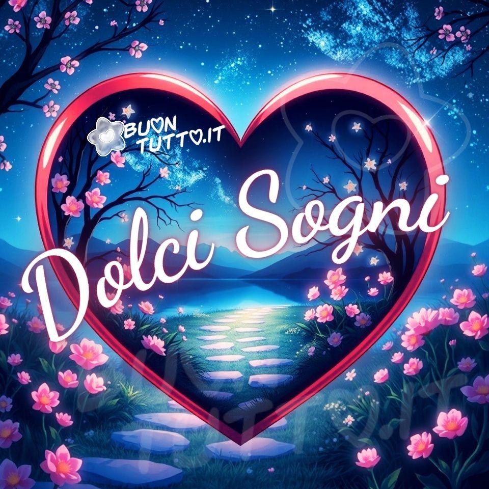 Disegno di un grande cuore rosso che occupa la parte centrale dell’immagine, come una finestra luminosa che racchiude un paesaggio notturno dal tono fiabesco. All’interno del cuore si apre un sentiero composto da pietre levigate, illuminate da una luce soffusa che crea riflessi morbidi e caldi. Il sentiero avanza in profondità, guidando lo sguardo verso montagne lontane, visibili come sagome bluastre immerse in una leggera foschia sotto un cielo trapunto di stelle. Ai lati del percorso, cespugli e alberi ricoperti di fiori rosa delicati sembrano brillare leggermente, come se fossero accarezzati dalla luce della luna. I rami fioriti incorniciano la scena con armonia, aggiungendo un tocco romantico e sereno. Sopra il paesaggio, il cielo scuro è punteggiato da stelle luminose distribuite in modo irregolare, creando un’atmosfera calma e contemplativa. La luce sembra respirare: morbida, calda, avvolgente. L’intera scena evoca un sogno che consola, un luogo dove il tempo rallenta e il cuore trova pace. L’immagine trasmette un profondo senso di quiete, come se fosse un rifugio immaginario in cui lasciarsi andare prima di addormentarsi. Al centro, sovrapposta al cuore rosso in forma semi‑circolare, appare la scritta “Dolci Sogni” in un elegante carattere corsivo bianco, leggermente luminoso e contornato da una sfumatura rosa. Il testo sembra fluttuare, trasformandosi in un augurio gentile perfetto per accompagnare il momento della buonanotte. Una raccolta di nuove e bellissime immagini della buonanotte da scaricare gratis e condividere con amici, familiari, gruppi e persone care tramite WhatsApp, Facebook, X Twitter, Pinterest, Telegram, LinkedIn, Instagram e tutte le tue piattaforme social preferite. Autore BuonTutto.it